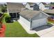 An aerial view showcasing a detached two-car garage with a well-manicured lawn at 1722 Winfield Way, Charleston, SC 29414