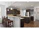 Beautiful kitchen featuring an island, granite countertops, and modern lighting at 1722 Winfield Way, Charleston, SC 29414