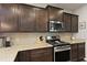 Well-equipped kitchen featuring a gas range, granite countertops, and ample cabinet space at 1722 Winfield Way, Charleston, SC 29414