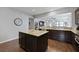Open-concept kitchen with island, granite counters, and seamless flow to the living area at 1722 Winfield Way, Charleston, SC 29414