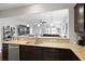 Kitchen with granite countertops and view to living room at 1722 Winfield Way, Charleston, SC 29414
