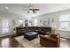 Spacious living room with a large sectional sofa, ceiling fan, and natural light at 1722 Winfield Way, Charleston, SC 29414
