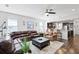 Open-concept living room seamlessly connects to the kitchen with hardwood floors at 1722 Winfield Way, Charleston, SC 29414