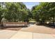 A brick entrance to Carolina Bay Park with lush trees and greenery at 1722 Winfield Way, Charleston, SC 29414