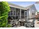 Outdoor patio with screened porch, comfortable seating, and a gas fire pit for entertaining at 1722 Winfield Way, Charleston, SC 29414