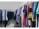 Well-organized walk-in closet filled with a variety of clothing items and ample hanging space at 1722 Winfield Way, Charleston, SC 29414