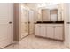 Modern bathroom with a glass shower, marble tile floors, and double sink vanity at 1730 Refuge Dr, Ladson, SC 29456