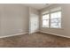 Cozy bedroom with carpet flooring, a large window with natural light, and a closet at 1730 Refuge Dr, Ladson, SC 29456