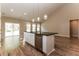Kitchen island with white cabinets, dark countertops, stainless steel dishwasher, and pendant lighting at 1730 Refuge Dr, Ladson, SC 29456