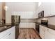 Modern kitchen with white cabinets, stainless steel appliances, and granite countertops at 1730 Refuge Dr, Ladson, SC 29456