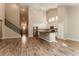 Spacious living room and kitchen area with hardwood floors, white cabinets, and modern appliances at 1730 Refuge Dr, Ladson, SC 29456
