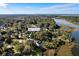 Aerial view of a waterfront neighborhood showing the property surrounded by lush greenery and water access at 1834 Cornish Ave, Charleston, SC 29412