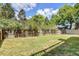 Lush backyard, bordered by a well-maintained wooden fence, provides privacy and a sense of natural beauty at 1834 Cornish Ave, Charleston, SC 29412