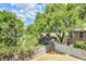 A view of a spacious backyard with lush trees and a fence creating a private outdoor space at 1834 Cornish Ave, Charleston, SC 29412