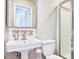 A full bathroom featuring a mirror, pedestal sink, toilet, and glass shower with white wall paint at 1834 Cornish Ave, Charleston, SC 29412