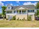 Charming two-story home featuring a welcoming front porch and stairs leading to the entrance at 1834 Cornish Ave, Charleston, SC 29412