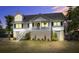 Inviting two-story home with a cozy front porch, perfect for relaxing evenings at 1834 Cornish Ave, Charleston, SC 29412