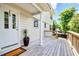 Charming home with a welcoming front porch, perfect for enjoying the outdoors with a decorative potted plant at 1834 Cornish Ave, Charleston, SC 29412