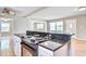 Kitchen island features cooktop and breakfast bar, offering convenient meal prep and seating at 1834 Cornish Ave, Charleston, SC 29412