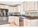 Well-equipped kitchen features stainless steel appliances, tile backsplash, and bright lighting at 1834 Cornish Ave, Charleston, SC 29412