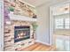 Cozy living room features a charming brick fireplace and hardwood floors at 1834 Cornish Ave, Charleston, SC 29412