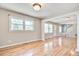 Spacious living area featuring hardwood floors, bright windows, and elegant white columns at 1834 Cornish Ave, Charleston, SC 29412