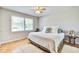 Comfortable main bedroom with hardwood floors, pillows, and ample natural light at 1834 Cornish Ave, Charleston, SC 29412