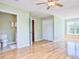Large main bedroom with ensuite bathroom, hardwood floors, large closet, and natural light at 1834 Cornish Ave, Charleston, SC 29412