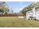 Spacious backyard featuring a patio dining area and large grassy area perfect for outdoor activities at 19 Ponce De Leon Ave, Charleston, SC 29407