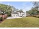 Expansive backyard featuring a well-maintained lawn and an oversized driveway with garage at 19 Ponce De Leon Ave, Charleston, SC 29407