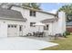 Backyard features a patio with outdoor dining set and seating area, and an oversized driveway with garage at 19 Ponce De Leon Ave, Charleston, SC 29407