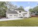 Exterior home elevation featuring a well-maintained lawn and an oversized driveway with garage at 19 Ponce De Leon Ave, Charleston, SC 29407