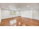 Spacious, well-lit basement with hardwood floors and a window for natural light at 19 Ponce De Leon Ave, Charleston, SC 29407