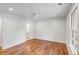 Bright bedroom with hardwood floors and an ensuite bathroom at 19 Ponce De Leon Ave, Charleston, SC 29407