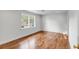 Inviting bedroom with hardwood floors, a ceiling fan, and a large window at 19 Ponce De Leon Ave, Charleston, SC 29407