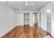 Bedroom featuring hardwood floors, a closet, and access to the bathroom at 19 Ponce De Leon Ave, Charleston, SC 29407