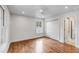 Bright bedroom features hardwood floors, a ceiling fan, and a window with natural light at 19 Ponce De Leon Ave, Charleston, SC 29407