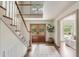 Open foyer featuring hardwood floors, a staircase with wood treads and access to the living space at 19 Ponce De Leon Ave, Charleston, SC 29407