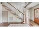 Foyer with hardwood floors, staircase with white risers, and access to adjacent rooms at 19 Ponce De Leon Ave, Charleston, SC 29407
