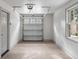 Clean garage with epoxy flooring, an automatic door, and a window at 19 Ponce De Leon Ave, Charleston, SC 29407