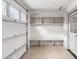 Garage with epoxy floors, built-in storage, work bench, and a window for natural light at 19 Ponce De Leon Ave, Charleston, SC 29407