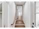 View of hallway featuring hardwood stairs and wood floors, leading to the main area at 19 Ponce De Leon Ave, Charleston, SC 29407