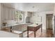 Well-lit kitchen with updated appliances, marble countertops, and an island with a wooden base at 19 Ponce De Leon Ave, Charleston, SC 29407