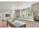 Open kitchen with an island featuring marble countertops, sleek cabinetry, and stainless steel appliances at 19 Ponce De Leon Ave, Charleston, SC 29407
