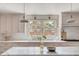 Bright kitchen featuring marble countertops, pendant lighting, and stainless steel appliances at 19 Ponce De Leon Ave, Charleston, SC 29407