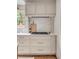 Neutral-toned kitchen featuring marble countertops, shaker cabinets, and stainless steel appliances at 19 Ponce De Leon Ave, Charleston, SC 29407