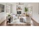Bright living room with a fireplace, a comfortable seating area, and a decorative tree at 19 Ponce De Leon Ave, Charleston, SC 29407