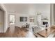 Inviting living room with fireplace, hardwood floors, and natural light at 19 Ponce De Leon Ave, Charleston, SC 29407