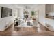 Bright and cozy living room featuring fireplace, ceiling fan and modern decor at 19 Ponce De Leon Ave, Charleston, SC 29407