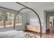 Serene main bedroom with hardwood floors, a modern cabinet, and large windows at 19 Ponce De Leon Ave, Charleston, SC 29407